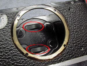 the flat leaf springs in their slots (red circles) note the round groove milled into the back around the springs. this is the pressure plate groove.